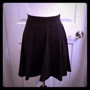 Black A-line mid length skirt
